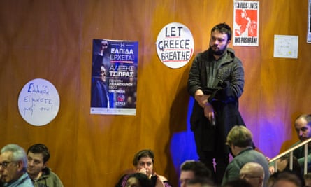 A man listens as speakers celebrate Syriza's victory, at the meeting in London this week.