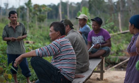 Sukirana, center, a farmer and local leader within Serikat Petani Indonesia - a peasant farmers movement - sat by his house within Harapan Rainforest in January 2013. Harapan Rainforest is a joint venture between the RSPB, Birdlife International and Burung Indonesia, a local bird conservation group. The project aims to restore an area of degraded forest close to the size of London but faces stiff competition from landless farmers.Indonesiaasiabathin sembilanbirdlifeboysburungcarboncolm o'molloyconflictconservationculturedarkdenmarkenvironmentfarmersfarmingfoodforestgasgermanyharapanindigenousjambikfwloggingnaturalnaturepaperplantationrainforestredreddresourcesroyal society for the protection of birdsrspbsocialsukiransumatratimberwood