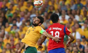 Mile Jedinak and Lee Jeonghyeop battle it out in the air.