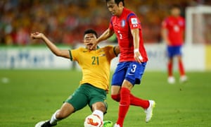 Massimo Luongo gets palmed off by Kim Jin Su but still manages to get a foot to the ball.