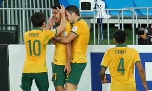 Massimo Luongo celebrates with his teammates after giving Australia the lead late in the first half.