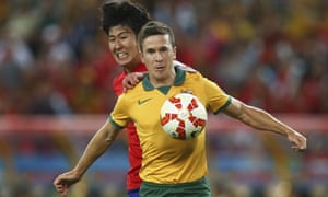 Matt McKay shields the ball from Son Heung Min as South Korea push for an equaliser.