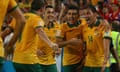James Troisi celebrates with the rest of the Socceroos after hitting the winner in the Asian Cup final.