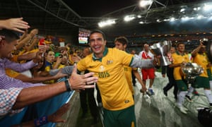 Tim Cahill laps up the adoration from fans after the final whistle.