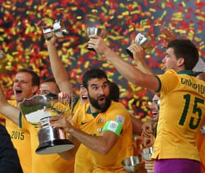 Mile Jedinak seems shocked by the antics of his fellow Asian Cup winners.