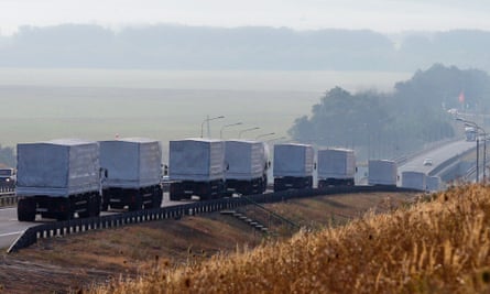 A Russian convoy of trucks carrying humanitarian aid for Ukraine travels along a road south of the city of Voronezh in August 2014.