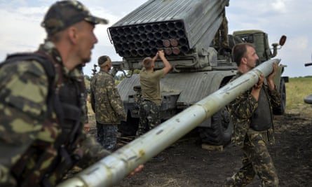 Ukrainian soldiers charge a Grad multiple rocket launcher system, near the eastern Ukrainian city of Shchastya, Luhansk region, in August 2014. Russian-backed rebels use similar weaponry.