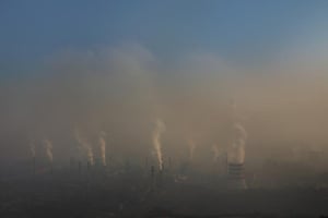 Everyday, from the Qian'an Jiujiang Wire Steel Mill complex in Tangshan huge clouds of pollutants including sulfur dioxide, carbon dioxide, heavy metal ions, and dioxins are belched into the sky. Seen from afar, the sky above the factories shows a clearly defined line of haze .