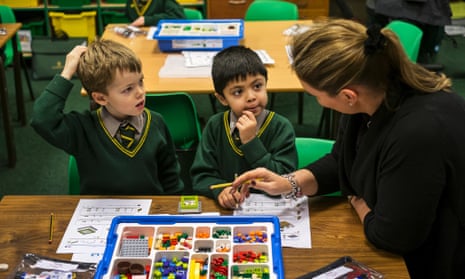 Sebastian and Amar learn their sums with Lego at Birchfield school, with their teacher Emma Grant-King.