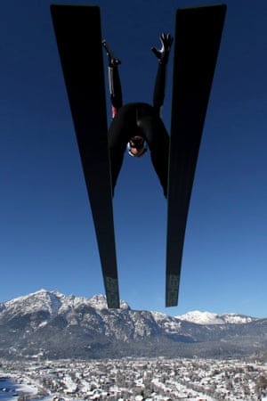 Severin Freund soars through the air during a training jump at Garmisch-Partenkirchen, Germany, the second tournament venue