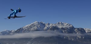 Lauri Asikainen soars through the air in Garmisch-Partenkirchen