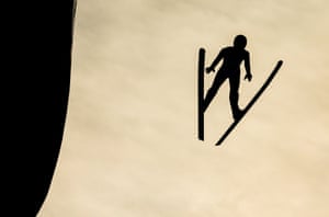 Peter Prevc is silhouetted after leaving the ski jump at Innsbruck, Austria, the third tournament venue