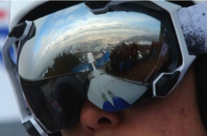 A reflection of the Alps mountain 'Nordkette' is seen in the googles of Junshiro Kobayashi as he prepares for a jump in Innsbruck