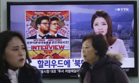 A TV screen at a train station in Seoul features news coverage of controversy surrounding the Hollywood film The Interview.