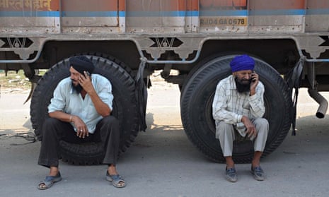 Indian truck drivers wait