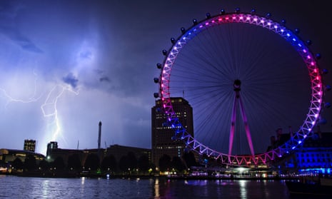 Lightning strikes behind the London Eye in central London on Tuesday July 23, 2013.