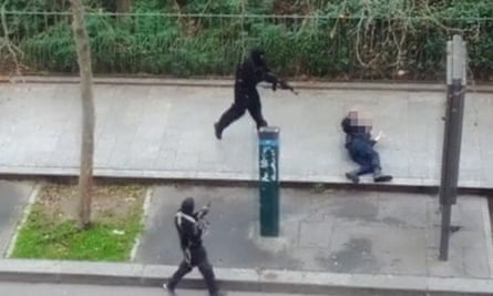 Gunmen shoot a wounded police officer (right) on the ground at point-blank range as they flee the offices of French satirical newspaper Charlie Hebdo.