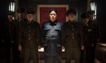 A shot from The Interview, with Kim Jong-un played by Randall Park (c). North Korea entered a protest to the United Nations against the Hollywood comedy before the hack on Sony Pictures.