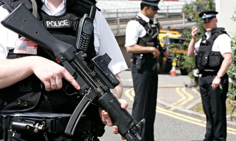 Armed policemen patrol Heathrow Airport in London