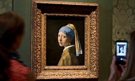 Vermeer's Girl with a Pearl Earring, hanging in the Mauritshuis.