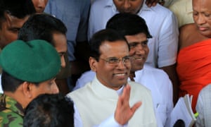 Sri Lanka's newly elected President Maithripala Sirisena waves as he leaves the Department of Election office after the election commissioner officially declared him as the new President on January 9, 2015 in Colombo, Sri Lanka.