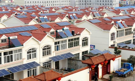 Solar panels on the roofs of residential houses in Qingnan village in Jiangsu province, China. Solar power investment soared in 2014.