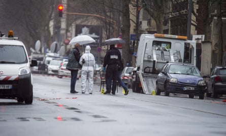 Police inspect the shooting scene in Montrouge, Paris, after a policewoman was shot dead