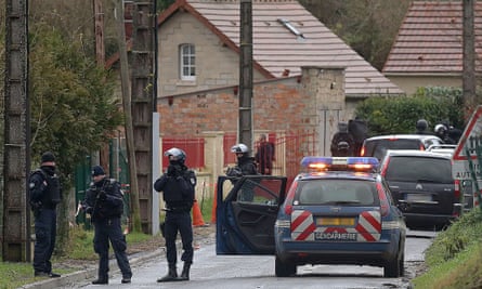 French police special forces in Corcy, near Villers-Cotterets, north-east of Paris, where the two suspects were spotted in a gray Clio