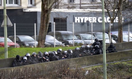 French police take position by the kosher grocery store in Saint-Mande, eastern Paris.