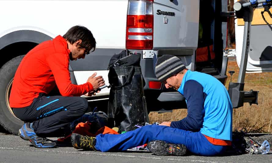 Kevin Jorgensen and Tommy Caldwell prepare their climbing gear.
