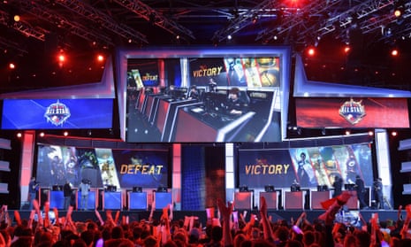 Visitors cheer for international teams during the tournament of the computer game "League of Legends" on May 8, 2014 in Paris.