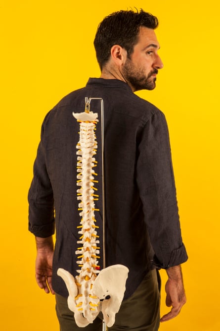Dara Mohammadi with a replica spine.