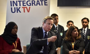 David Cameron speaks with schoolchildren on the day his government has announced its strategy to "systamatically confront" extreemism in the UK.