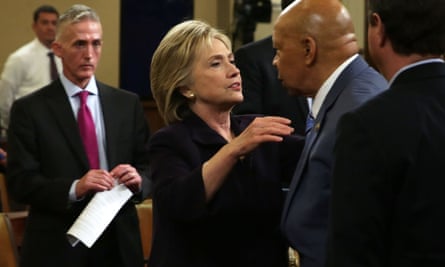 Chairman Trey Gowdy, left, hovers as Hillary Clinton is greeting by ranking member and fellow Democrat Elijah Cummings