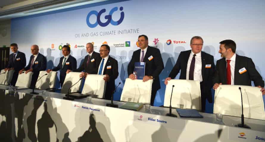 Oil company bosses announce their support for an agreement that keeps global temperatures within 2C on October 16, 2015 in Paris.