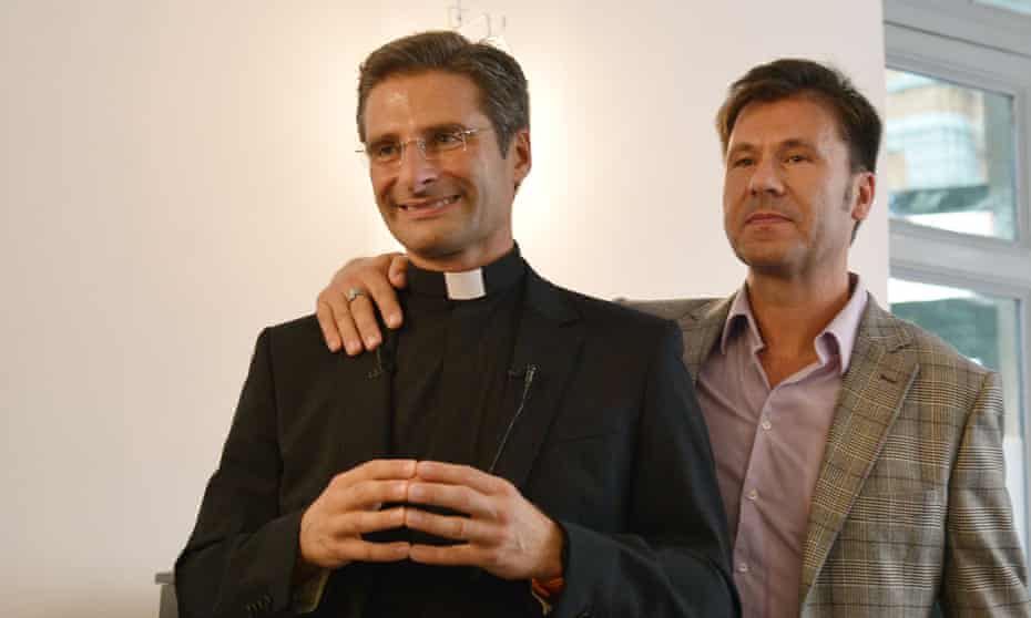 Father Krzysztof Charamsa and his partner Edouard at their press conference.