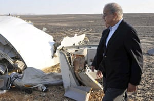 Egypt’s prime minister, Sherif Ismail, looks at the remains of the crashed plane near al-Arish city.