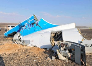 Debris from the jet lies strewn across the sand at the site of the crash.