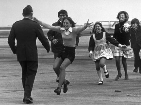 Released prisoner of war Lt Col Robert L Stirm is greeted by his family at Travis air force base, California, on his return home from the Vietnam War, 17 March 1973. In the lead is Stirm's daughter Lorrie, 15, followed by son Robert, 14, Cynthia, 11, wife Loretta and Roger, 12.