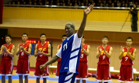 Dennis Rodman in 2014, waving to North Korean leader Kim Jong Un before an exhibition basketball game featuring US and North Korean players.