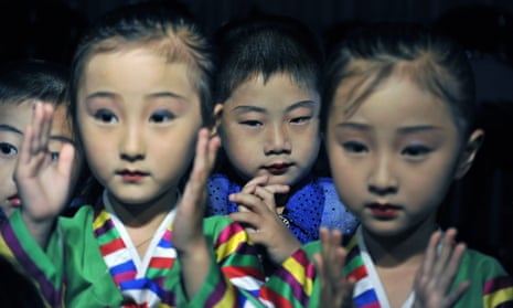North Korean children finish a performance for foreign tourists to celebrate the 60th anniversary of Korean War.