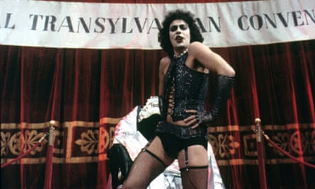Curry successful dense makeup, a achromatic basque, stockings and suspenders.