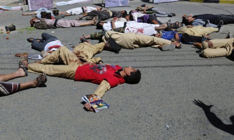 Yemenis play the victims of airstrikes during a protest against ongoing Saudi-led coalition military operations in the country, in front of the UN offices in Sana a, Yemen, 08 November 2015. According to the United Nations, around 5000 people have been killed, 25,000 wounded, many of them civilians, and millions forced to flee their homes and left extremely food insecure since the excalation of the conflict in the impoverished Arab country in March.