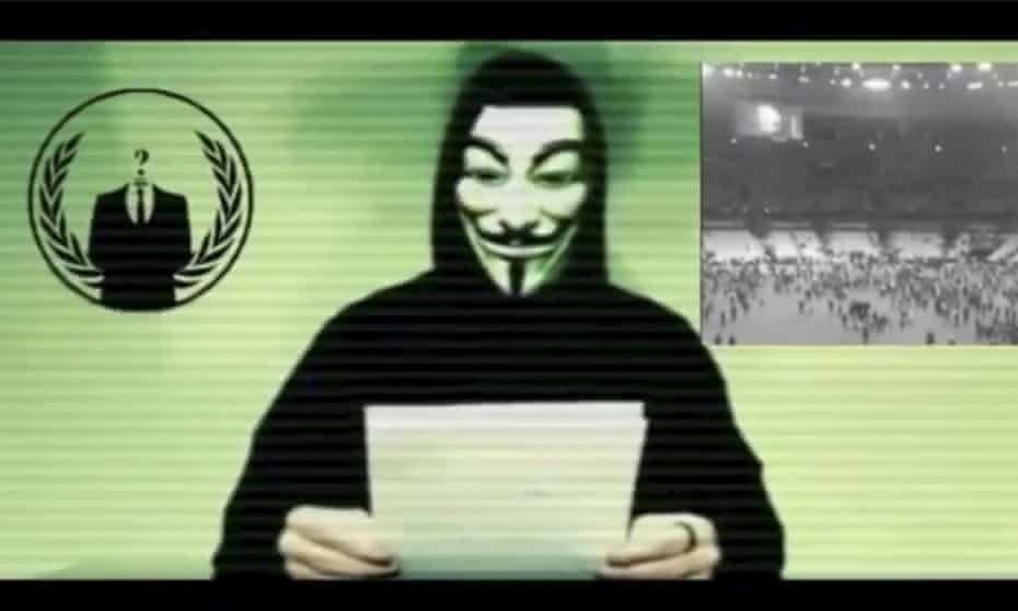 A man wearing a mask associated with Anonymous makes a statement in this still image from a video released on 16 November, 2015.