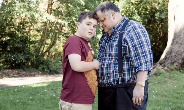 Steve Silberman and Leo Rosa, 14, who has autism and likes to calm himself with green straws from Starbucks.