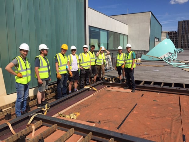 Helping to put his 'spaceship' back together on the CSM roof terrace: artist Craig Barnes, third from left. 