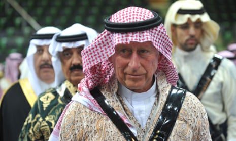 Britain's Prince Charles arrives to participate in the traditional Saudi dancing known as 'Arda' during the Janadriya culture festival at Der'iya in Riyadh, in February, 2014.