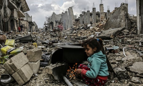 Kurdish Syrian girls among rubble in the Syrian town of Kobane in March 2015