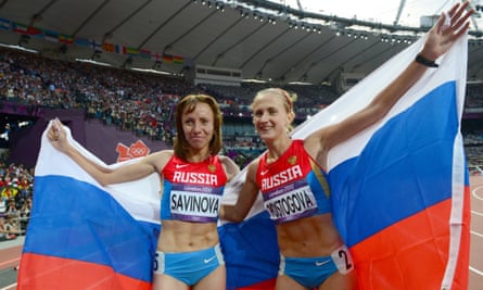 Mariya Savinova (L) celebrating with Russia's bronze medalist Ekaterina Poistogova
