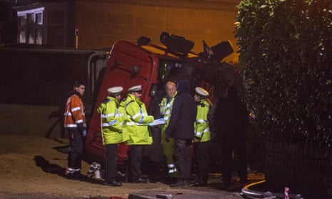 The lorry lies on its side following the crash. It has since been removed and taken away for tests